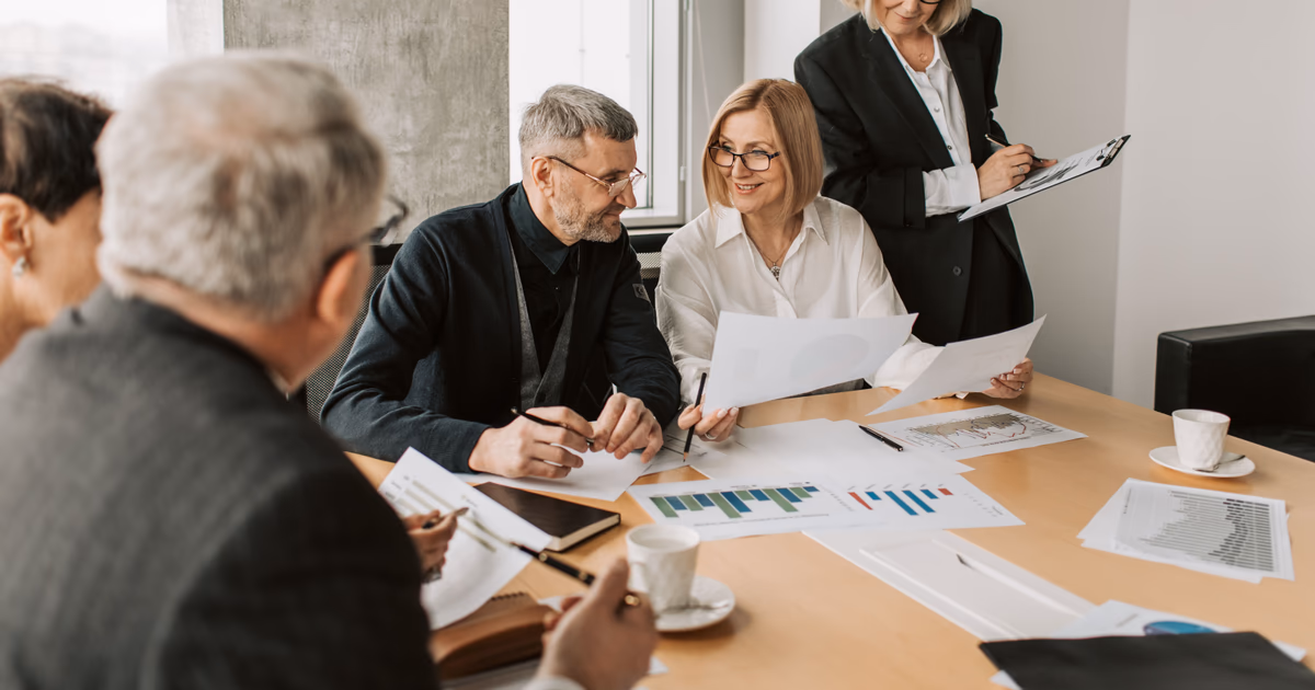 Business team comparing operational reports before moving from spreadsheets to a connected system